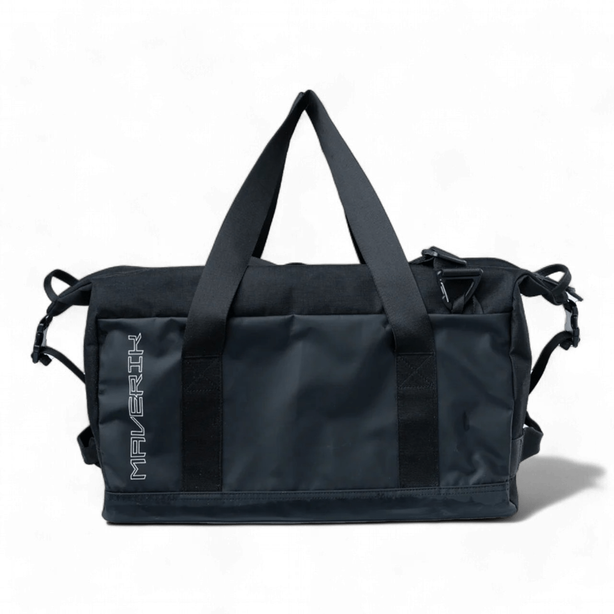 The Maverik Road Trip Duffle Bag, available in black, includes two durable shoulder straps and a secure zipper closure. It features the signature Maverik logo in white, highlighting its sleek and sporty design. This bag is known for its heavy-duty durability, making it ideal for carrying lacrosse gear.