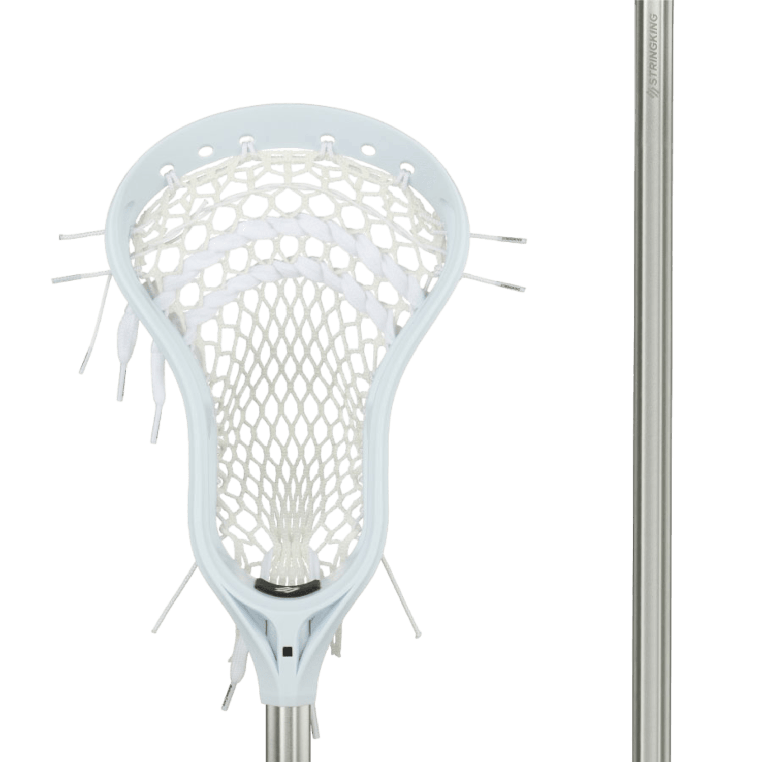 Close-up of the Stringking Complete 2 Defense - Intermediate lacrosse stick head, showcasing a white mesh pocket connected to a silver shaft. The strings visible along the sides of this defensive head enhance the detail against the simple green background.