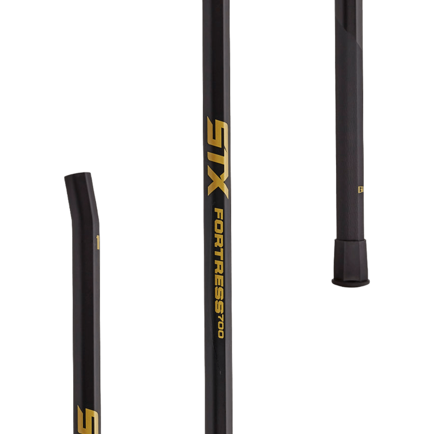 Close-up of components of a black STX Fortress 700 Lacrosse Shaft, highlighting the elite defender's tool designed with GRIP technology. The shaft displays a yellow STX logo and the model name in gold lettering on a solid green backdrop.