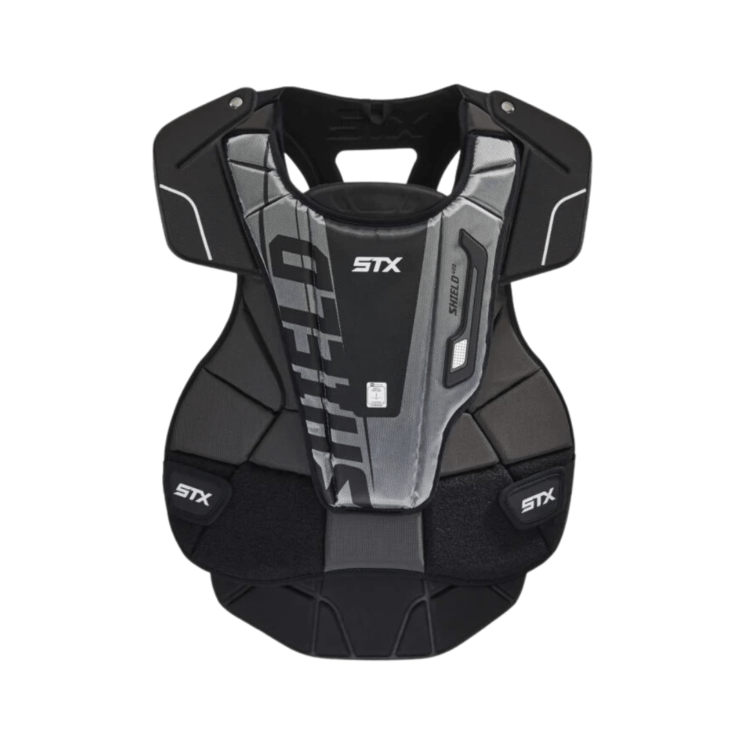 The image features a stylish black and gray STX Shield 400 Goalie Chest Pad. This STX-branded equipment is crafted for youth players and complies with NOCSAE standards, offering padded sections to guarantee superior protection and comfort on the field.