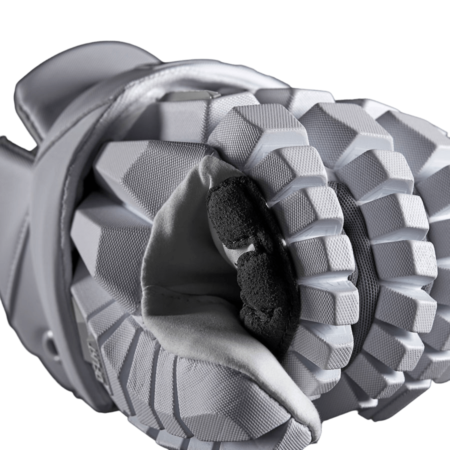 Close-up of a gray winter STX Surgeon RZR Lacrosse Glove featuring an Ax Suede palm with a textured, geometric design. The glove is folded, showcasing the soft interior and reinforced black padding on the palm. The meticulous stitching and premium materials ensure durability and grip, embodying 2nd SKIN palm technology.