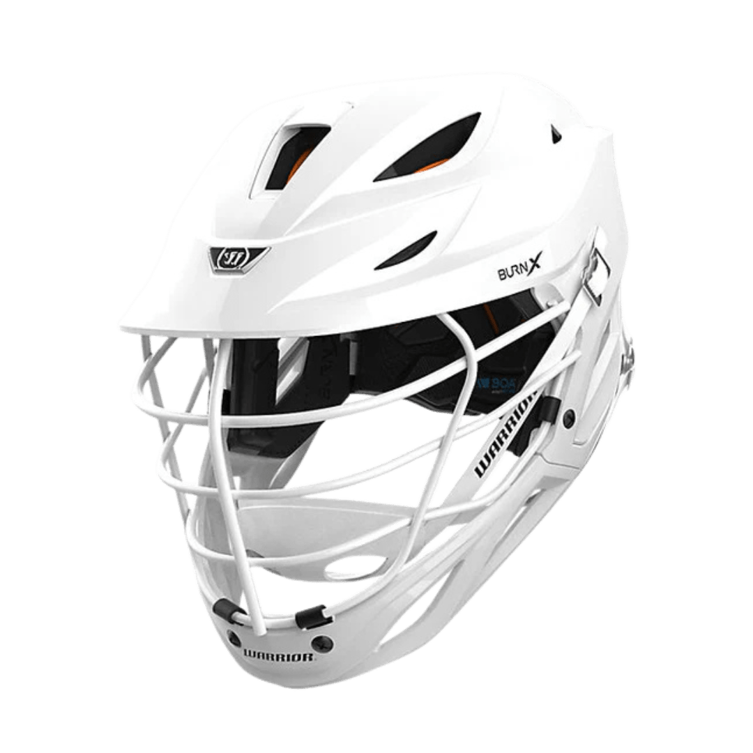 A Warrior Burn X Stock Lacrosse Helmet in white, complete with a faceguard, is displayed against a plain backdrop. It boasts the OMNISHOCK Protection System and includes ventilation openings, prominently showcasing the "Warrior" brand name on its side.